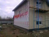 Дом из газоблоков.Утепление фасада базальтовой ватой,Изоспан и панели 
