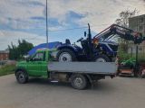 Услуги  миниэкскаватора  и  доставка  минитрактора  клиентам  на  своём бортовой уазе 