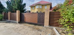 Откатные ворота из сайдинга и лазерной резки
