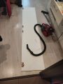 Вырвана петля из ДСП створки шкафа. Нанёс авто шпаклевку.
