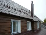 кровля из металлочерепицы с утеплением, фасад - имитация бруса с утеплением.